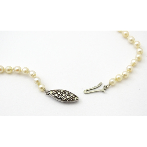 748 - A cultured pearl single necklace with silver  and marcasite clasp. Approx 18