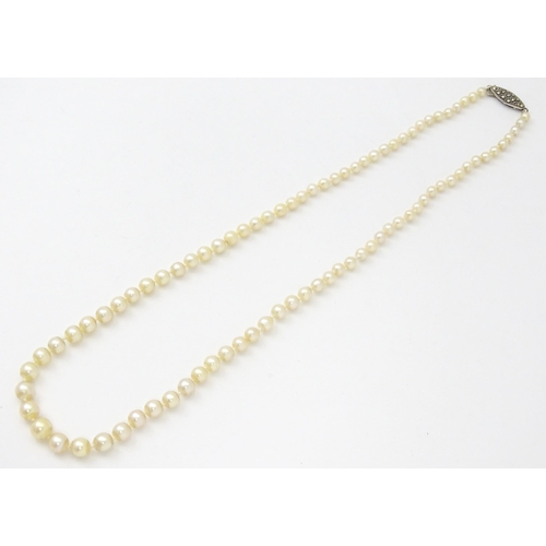 748 - A cultured pearl single necklace with silver  and marcasite clasp. Approx 18