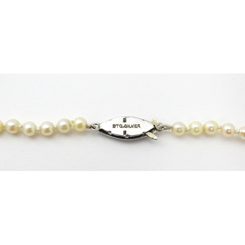 748 - A cultured pearl single necklace with silver  and marcasite clasp. Approx 18