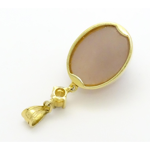 752 - A yellow metal pendant set with pink cabochon and diamond . Approx. 1 1/2