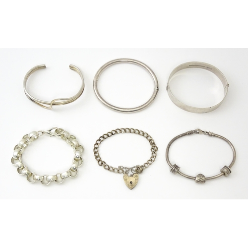 757 - Six silver and white metal bracelets to include one of bangle form with engraved decoration hallmark... 