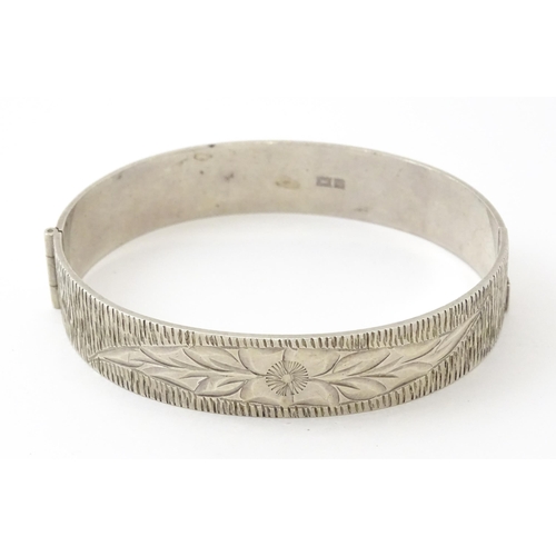 757 - Six silver and white metal bracelets to include one of bangle form with engraved decoration hallmark... 