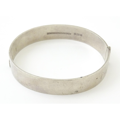 757 - Six silver and white metal bracelets to include one of bangle form with engraved decoration hallmark... 