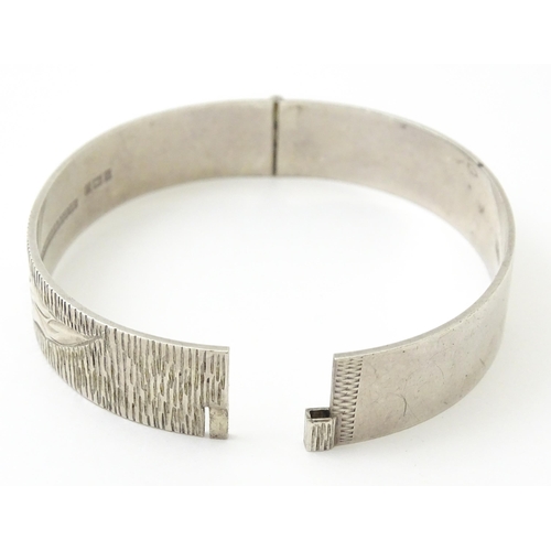 757 - Six silver and white metal bracelets to include one of bangle form with engraved decoration hallmark... 