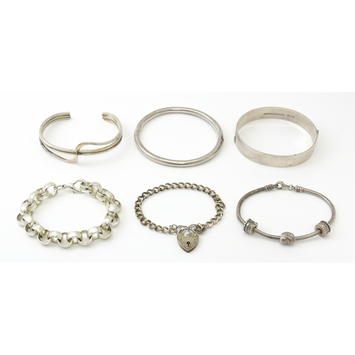 757 - Six silver and white metal bracelets to include one of bangle form with engraved decoration hallmark... 