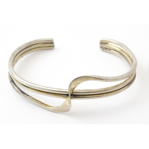 757 - Six silver and white metal bracelets to include one of bangle form with engraved decoration hallmark... 