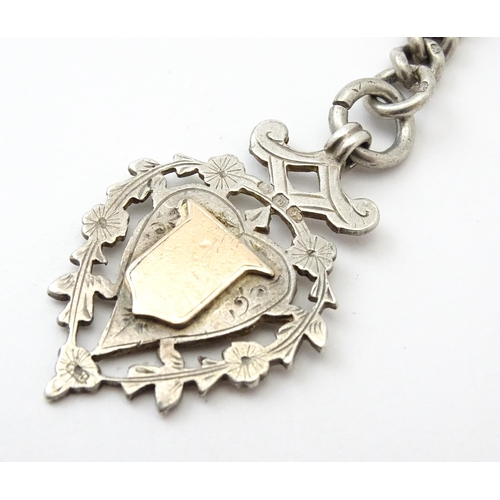 794 - A silver Albert watch chain with silver fob and T-bar. Chain approx. 13 1/2