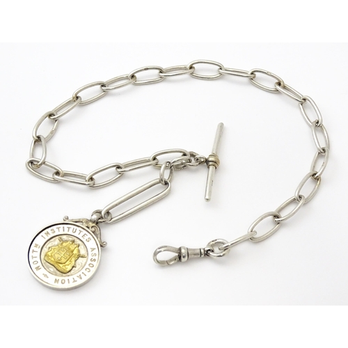 796 - A .925 silver watch chain with T-bar and silver fob. Approx. 15