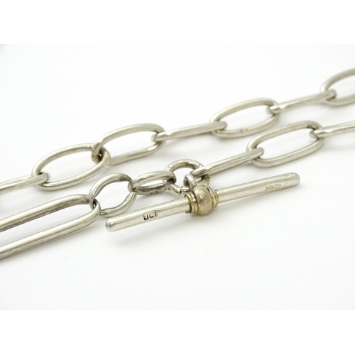 796 - A .925 silver watch chain with T-bar and silver fob. Approx. 15