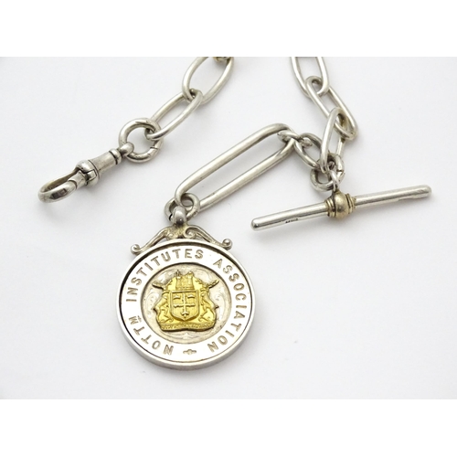 796 - A .925 silver watch chain with T-bar and silver fob. Approx. 15