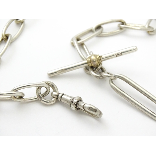 796 - A .925 silver watch chain with T-bar and silver fob. Approx. 15