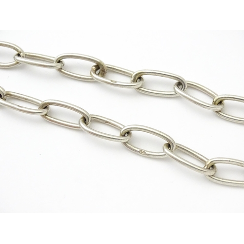 796 - A .925 silver watch chain with T-bar and silver fob. Approx. 15