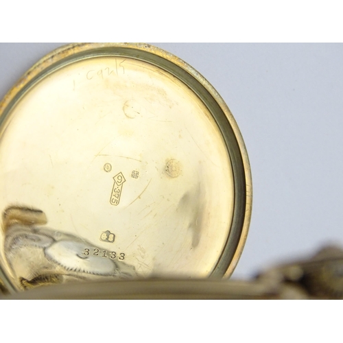 798 - A 9ct gold top wind pocket watch with Roman numerals and subsidiary Arabic seconds dial. The Case be... 