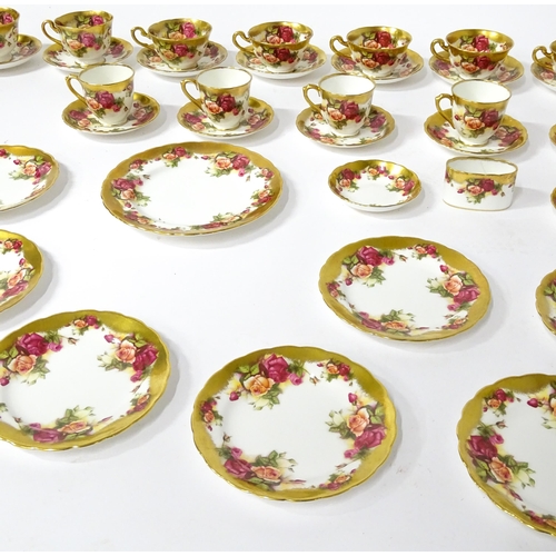 167 - A quantity of Royal Chelsea tea / coffee wares in the Golden Rose pattern to include cups, saucers, ... 