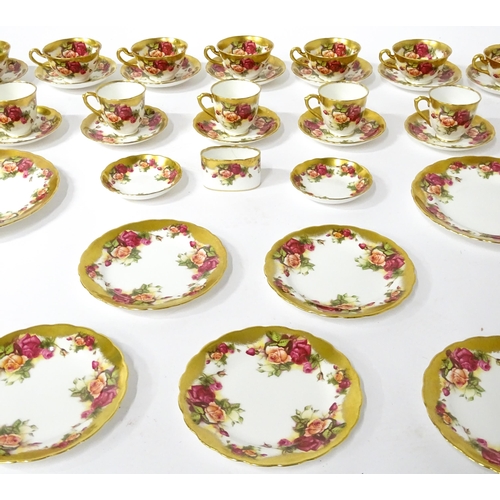 167 - A quantity of Royal Chelsea tea / coffee wares in the Golden Rose pattern to include cups, saucers, ... 