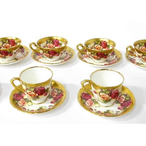 167 - A quantity of Royal Chelsea tea / coffee wares in the Golden Rose pattern to include cups, saucers, ... 