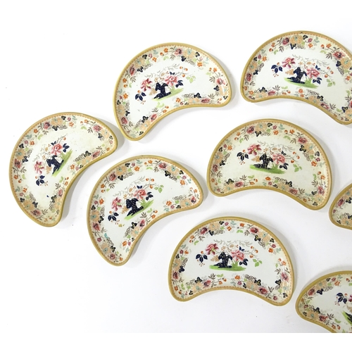 79 - Twelve Davenport crescent shaped salad dishes with floral and foliate decoration. Marked under. Appr... 