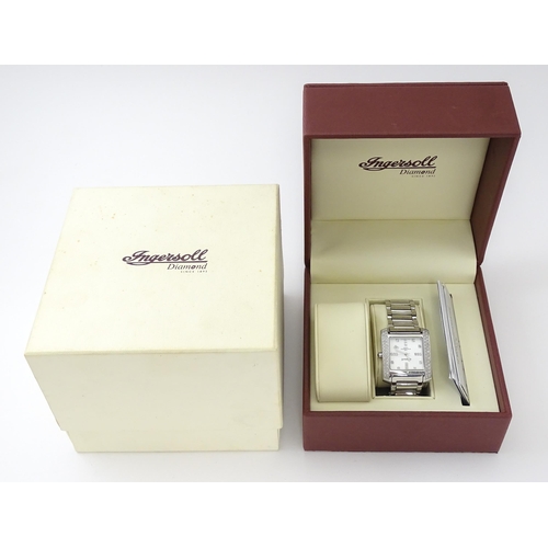 815 - A gentleman's Ingersol Diamond wristwatch, the stainless steel case and dial set with diamonds. With... 