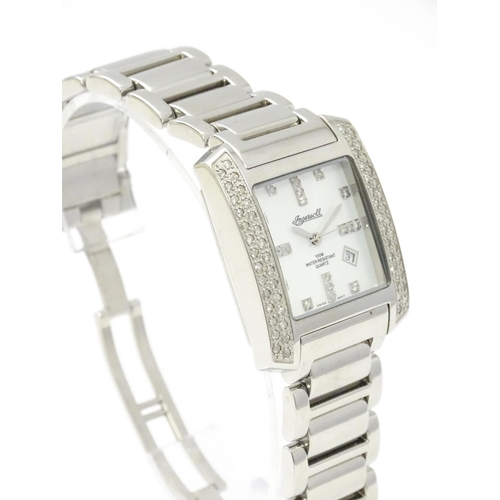 815 - A gentleman's Ingersol Diamond wristwatch, the stainless steel case and dial set with diamonds. With... 