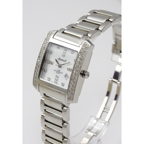 815 - A gentleman's Ingersol Diamond wristwatch, the stainless steel case and dial set with diamonds. With... 