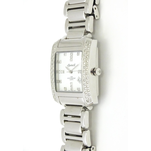 815 - A gentleman's Ingersol Diamond wristwatch, the stainless steel case and dial set with diamonds. With... 