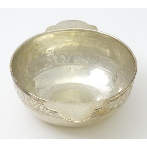 347 - A mid 20thC white metal bowl with twin handles. Possibly Indian together with a mother of pearl cham... 