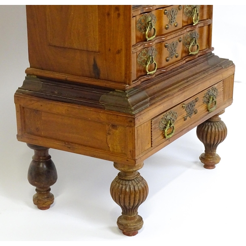 1442 - A 20thC Anglo - Indian bureau on stand with a fall front opening to show fitted drawers and pigeon h... 