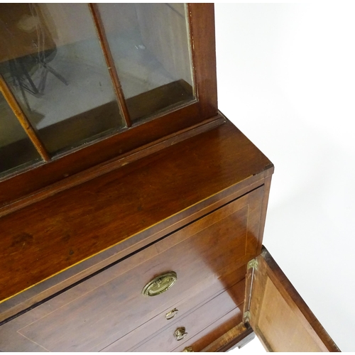 1443 - An early 19thC mahogany secretaire bookcase with an astragal glazed bookcase above a single secretai... 