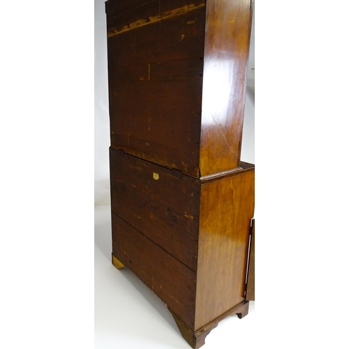 1443 - An early 19thC mahogany secretaire bookcase with an astragal glazed bookcase above a single secretai... 