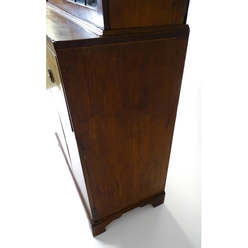 1443 - An early 19thC mahogany secretaire bookcase with an astragal glazed bookcase above a single secretai... 