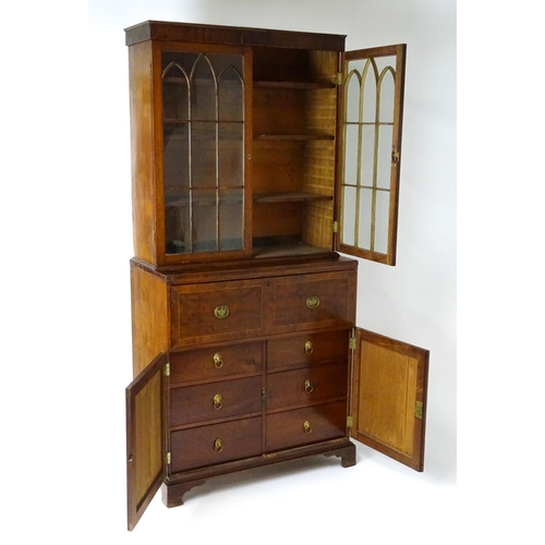 1443 - An early 19thC mahogany secretaire bookcase with an astragal glazed bookcase above a single secretai... 