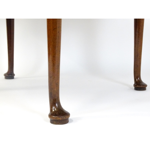 1473 - A Georgian mahogany drop flap table with two drop demi lune drop leaves raised on turned legs termin... 