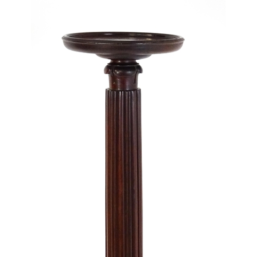 1485 - An early 20thC mahogany torchiere with a dished top above a turned reeded column with carved floral ... 