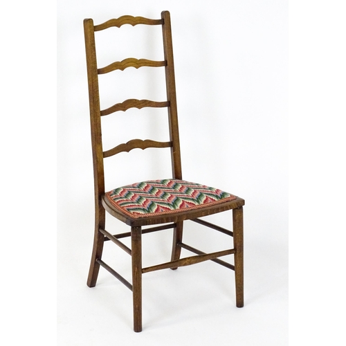 1489 - An early / mid 20thC side chair with a ladderback above an upholstered seat and raised on turned tap... 