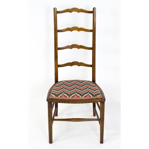 1489 - An early / mid 20thC side chair with a ladderback above an upholstered seat and raised on turned tap... 