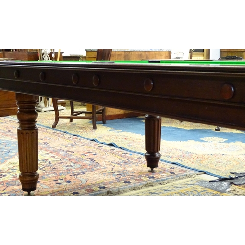 1492 - A late 20thC billiards / pool and dining table by Halstead, England, together with cues, balls and e... 