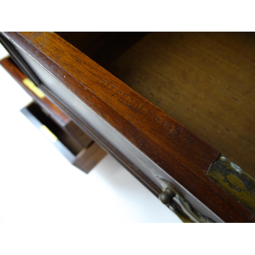 1437 - An Edwardian 'James Shoolbred & Co' walnut double pedestal desk with a single central drawer flanked... 