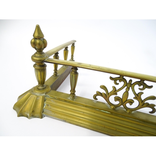 1299 - A 19thC brass fire fender, the gallery with acanthus decoration and spear terminals above a stepped ... 