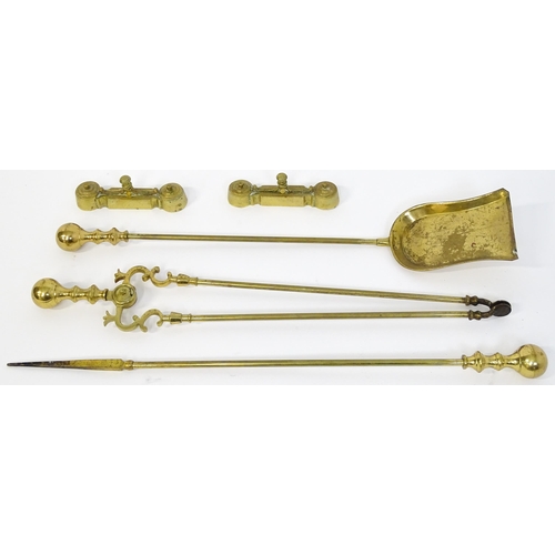 1301 - A set of three brass fire tools with ball terminals, comprising tongs, poker and shovel, together wi... 