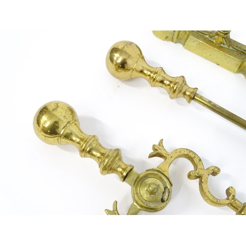 1301 - A set of three brass fire tools with ball terminals, comprising tongs, poker and shovel, together wi... 