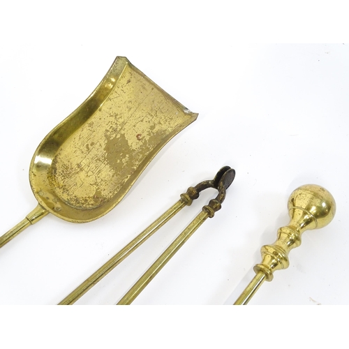 1301 - A set of three brass fire tools with ball terminals, comprising tongs, poker and shovel, together wi... 