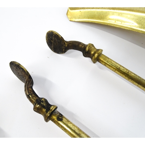 1301 - A set of three brass fire tools with ball terminals, comprising tongs, poker and shovel, together wi... 