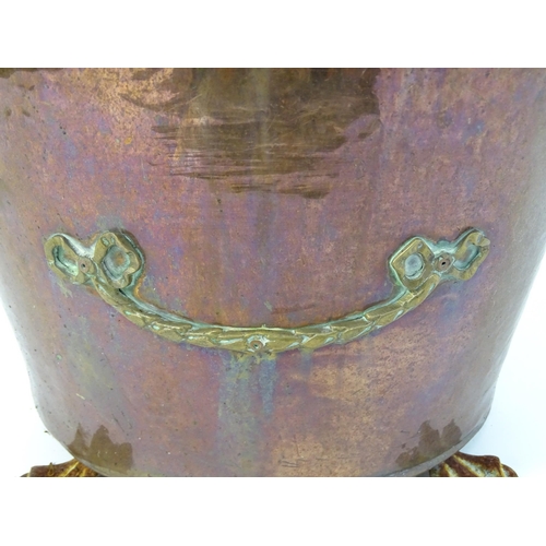 1302 - A late 19thC copper and brass coal bucket, of tapering oval form with lid, ring handles and removabl... 