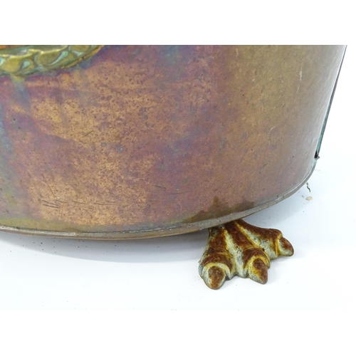 1302 - A late 19thC copper and brass coal bucket, of tapering oval form with lid, ring handles and removabl... 