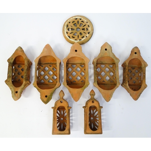 1306 - Assorted terracotta items comprising five Mediterranean-style garden wall light covers, together wit... 