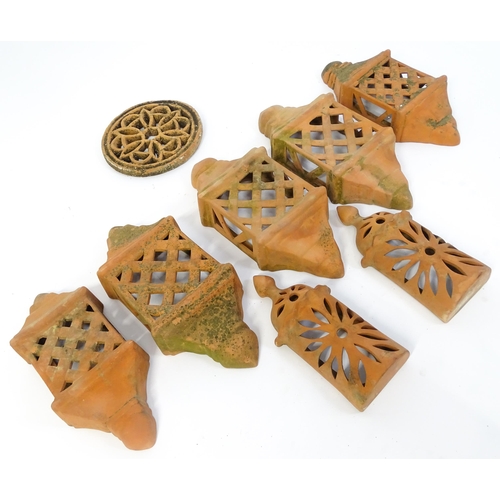 1306 - Assorted terracotta items comprising five Mediterranean-style garden wall light covers, together wit... 