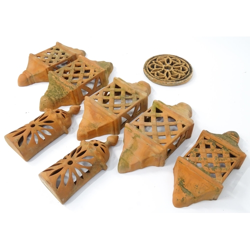 1306 - Assorted terracotta items comprising five Mediterranean-style garden wall light covers, together wit... 