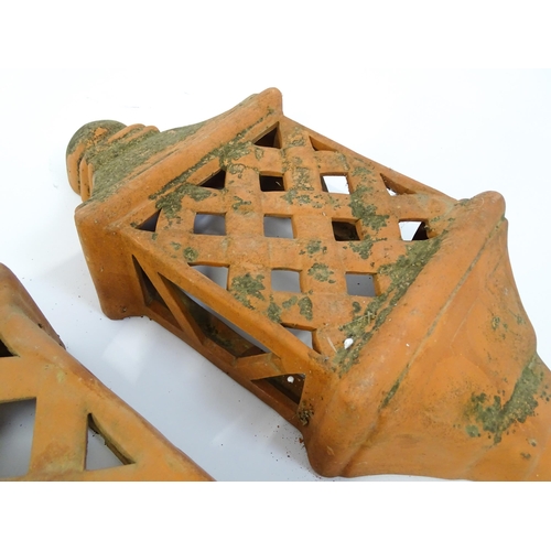 1306 - Assorted terracotta items comprising five Mediterranean-style garden wall light covers, together wit... 