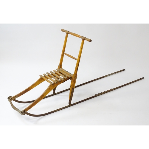 1236 - An early 20thC Norwegian kicksled. Bears remains of original label. Approx. 69