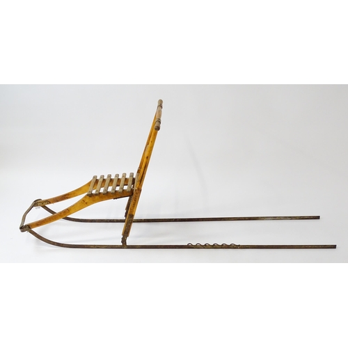 1236 - An early 20thC Norwegian kicksled. Bears remains of original label. Approx. 69